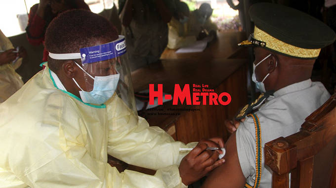 COMMISSIONER-GENERAL Moses Chihobvu receives his vaccine