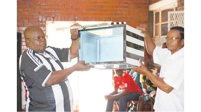 File picture: Ndumiso Gumede and member of the electoral committe Jimmy Ncube display a ballot box to the electorate before elections at club house. Highlanders has been plunged into a constitutional crisis following a decision by the board to extend the tenure of three executive committee members in January after being denied permission to gather for an annual general meeting and elections due to the Level 4 lockdown that was in force. A club member has threatened to haul the club to court.
