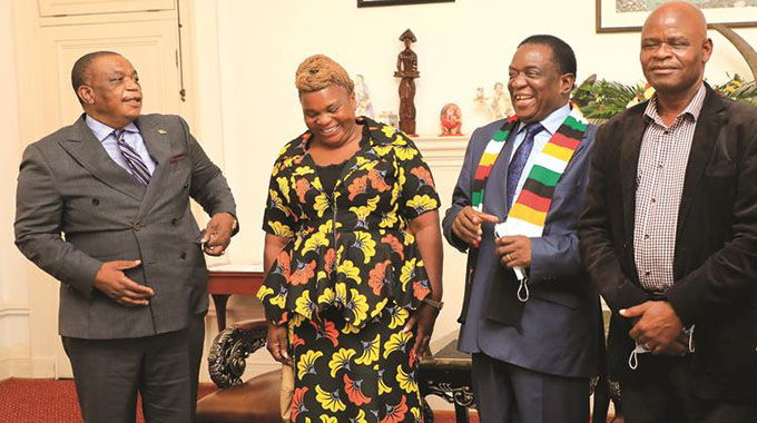 Former MDC Alliance deputy treasurer-general Lillian Timveos (centre) and former MDC-T official Blessing Chebundo (right) seen here with President Emmerson Mnangagwa and Vice President Constantino Chiwenga (left)