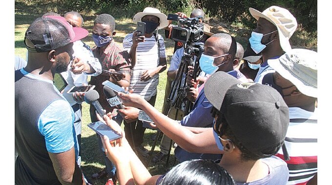 MEDIA SCRUM. . . Dynamos coach, Tonderai Ndiraya (left), addresses the media at the Glamour Boys’ training session, in Harare yesterday, as the Harare giants prepared for their Uhuru Cup showdown against Highlanders, at the National Sports Stadium, on Sunday — Picture by Kudakwashe Hunda