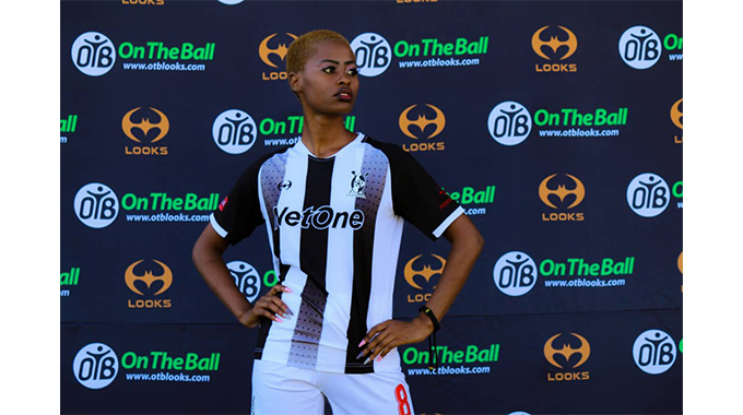 A model poses with the On The Ball (OTB) sponsored Bosso shirt