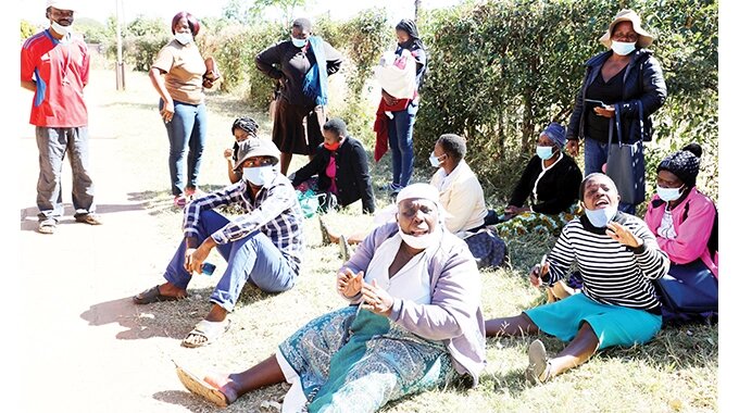 Fuming home-seekers stage a sit-in at Nketa housing office in Bulawayo yesterday after having paid for stands to the city council that were never availed. Picture by Dennis Mudzamiri