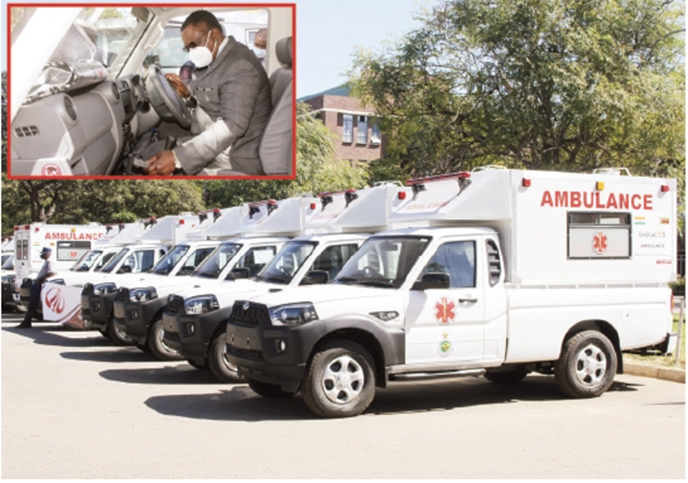 Acting President Constantino Chiwenga (inset) gets a feel of one of the ambulances donated by India and the African Development Bank in Harare yesterday. — Picture Innocent Makawa