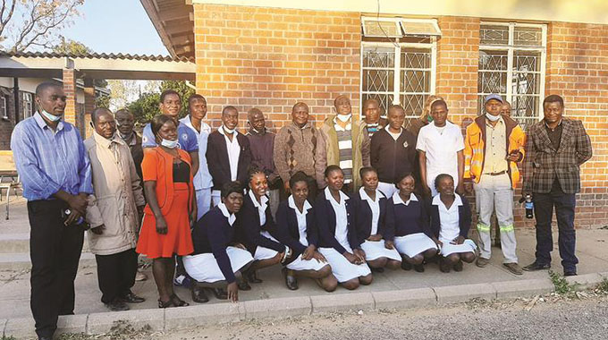 Health and Child Care Deputy Minister Dr John Mangwiro, (standing sixth from right) with Chief Chivese to his right, trainee nurses, lecturers and councillors at Chivhu General Hospital on Saturday