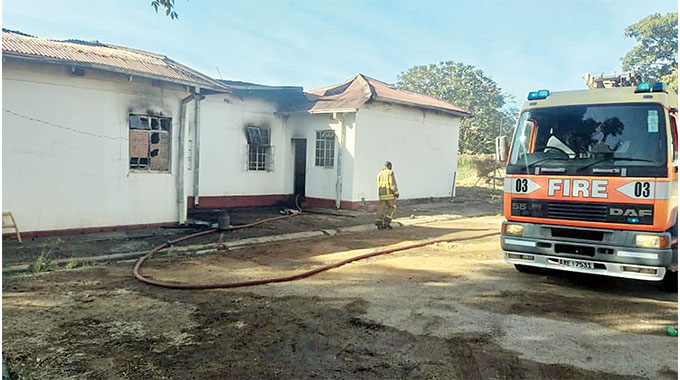 Fire fighters at Kwekwe General Hospital where a fire broke out and razed a staff residence