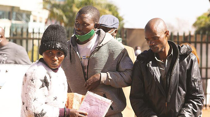 Suspected armed robbers Juliet Gavaza (left), Valentine Mutasa (centre) and Godfrey Josi arrive at the Harare Magistrate Courts yesterday