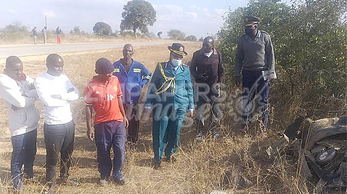 Assistant Commissioner Florence Marume (third from right) assesses the scene of the horror crash today that claimed 21 people along the Masvingo-Zvishavane road yesterday. She is accompanied by provincial police spokesperson Inspector Kudakwashe Dhewa (right) and some of the accident witnesses from Gondo village in the area