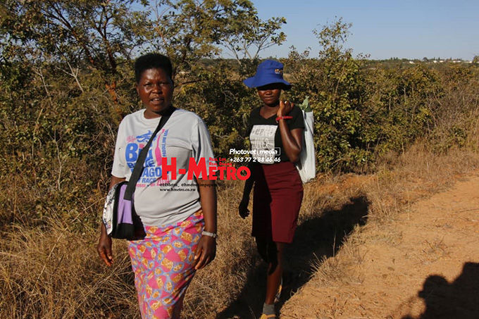 Villagers are seen going about their normal business without face masks