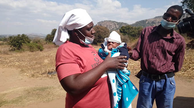Mr Remigio Nyakudya and his wife Ms Lydia Makisi holding baby Junior