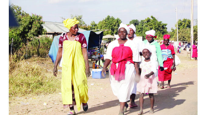 Apostolic sect church members go for a church service without wearing face masks in Epworth recently
