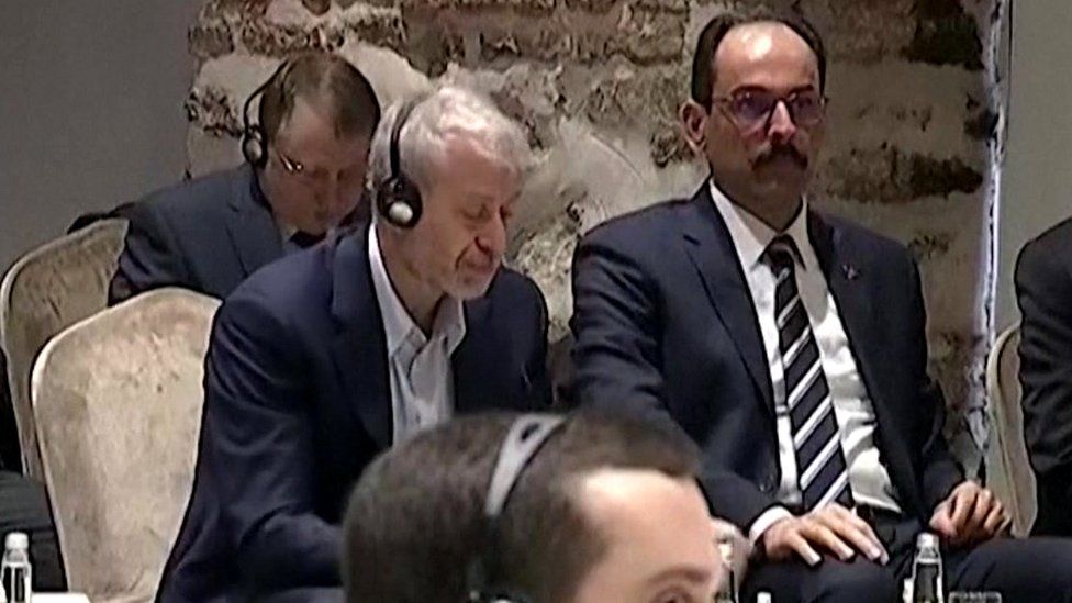 Roman Abramovich is seen sitting at a table alongside Ibrahim Kalin - a spokesman for President Recep Tayyip Erdogan (Picture via Turkish TV)