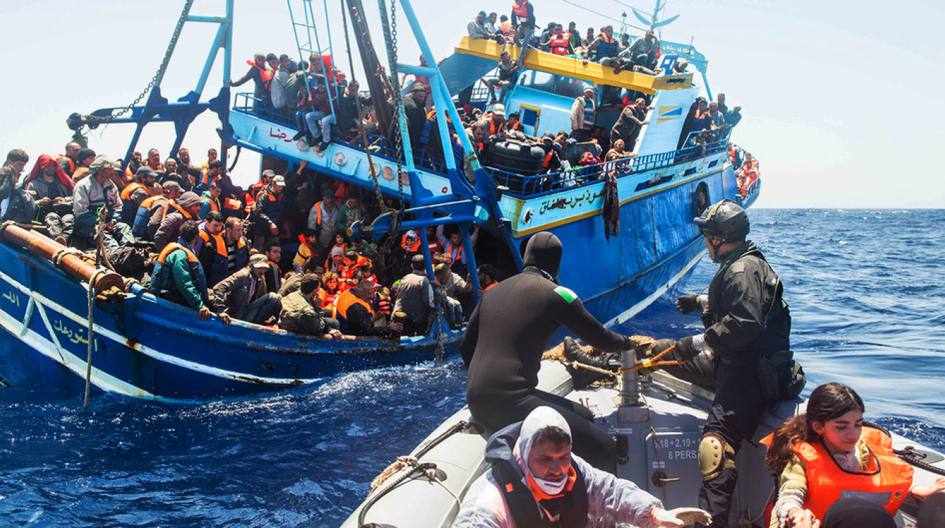 File picture of the Italian Navy rescuing migrants in the Mediterranean Sea. (Picture via Italian Coastguard/Massimo Sestini)
