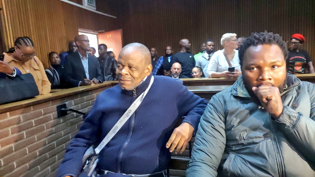Zolile Sekeleni (left), father of Thabo Bester’s partner Nandipha Magudumana, and former prison warder Senohe Matsoara were charged in the Bloemfontein Magistrates Court on Tuesday (Picture via Silindelo Masikane for eNCA)