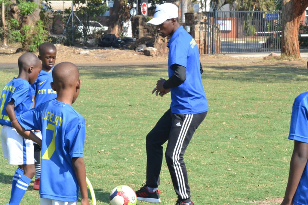 City Football Academy owner Agrippa Guti demonstrating a drill to his academy players.
