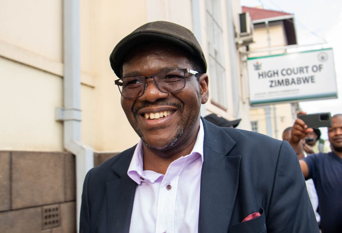 Sengezo Tshabangu smiles as he walks away from the High Court building where he is seeking a court order blocking recalled CCC legislators from taking part in by-elections (Picture via ZimLive)