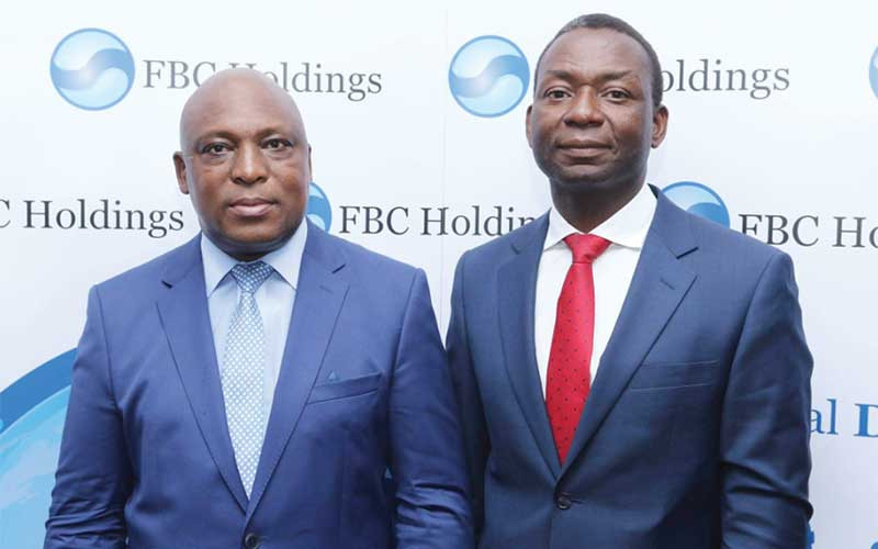 Trynos Kufazvinei (right) joined FBC Limited in January 1998 as head of finance and administration and will now replace departing CEO John Mushayavanhu (left)