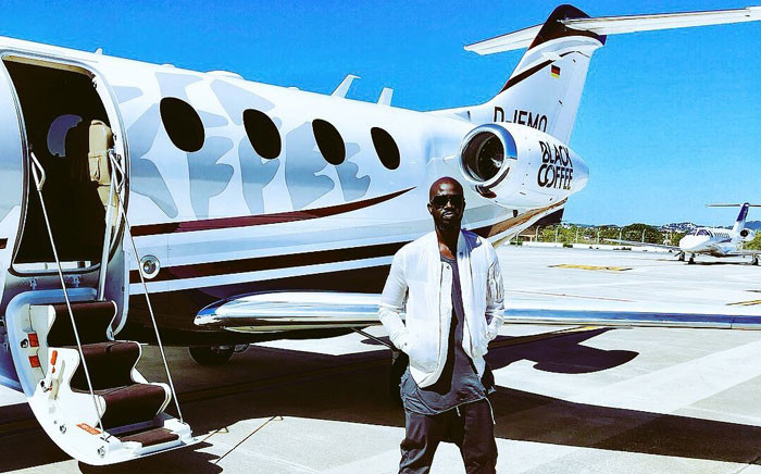 South African DJ Black Coffee poses next to a personalised jet. (Picture via @RealBlackCoffee/Twitter)