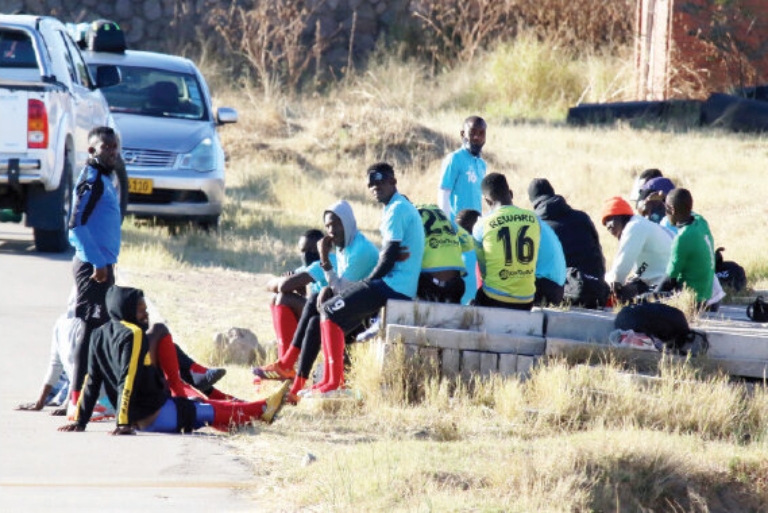 Highlanders players sit out a training session (June 4, 2021) at White City Stadium as they pressed for a salary review