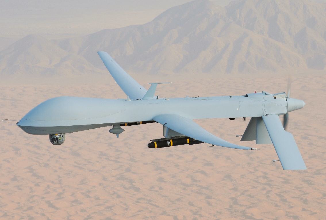 An MQ-1 Predator, armed with AGM-114 Hellfire missiles, piloted by Lt. Col. Scott Miller on a combat mission over southern Afghanistan. (U.S. Air Force Photo / Lt. Col. Leslie Pratt - Public domain, via Wikimedia Commons)