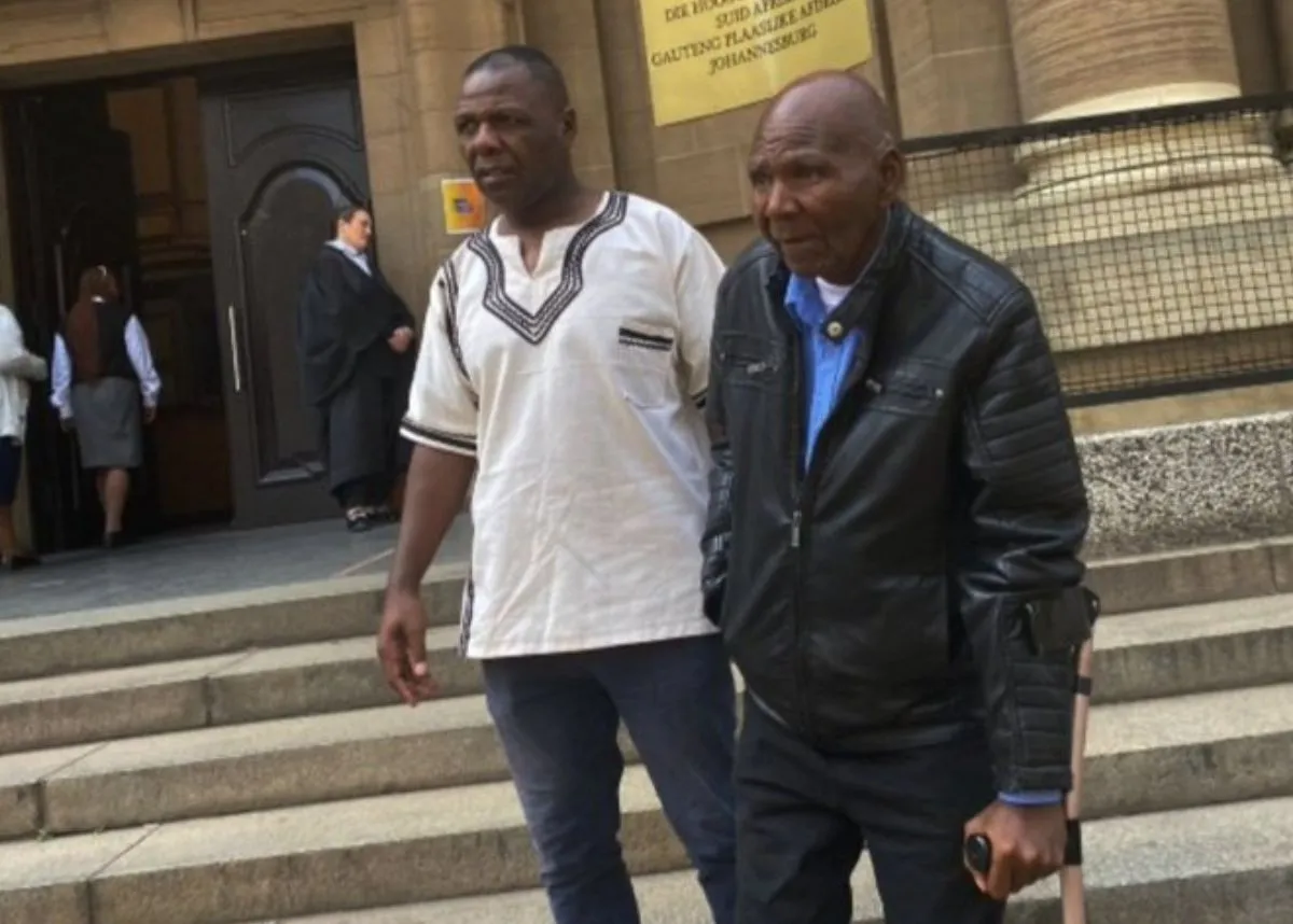 Dingaan Thobela's brother, Bongani and their father, Godfrey at the Johannesburg High Court. (Image via X @ZimojaL)