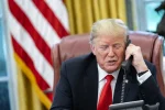 New United States bill seeks to rewrite foreign policy for Zimbabwe and Africa Washington D.C., USA - September 4 2019: Close-up waist-up portrait shot of Donald Trump speaking on the phone sitting in a chair in the Oval Office of the White House — Photo by Tennessee via DepositPhotos.com