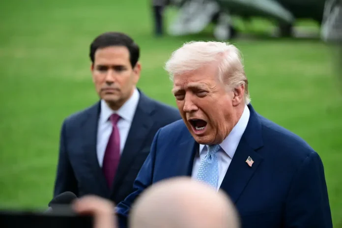 U.S. President Donald J. Trump speaks to reporters on the Strait of Hormuz, Iran, the death of Chuck Norris and news of the day while accompanied by United States Secretary of State Marco Rubio prior to departing on the South Lawn — Photo by thenews2.com via DepositPhotos.com