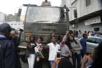 Mnangagwa reproducing the very conditions that facilitated Mugabe’s downfall Harare,Zimbabwe,18 November 2017. Flag waving anti-Mugabe protesters taking selfies in front of an army truck during anti -Mugabe demostrations in solidarity with the miullitary intervention. — Photo by Maboss283 via DepositPhotos.com