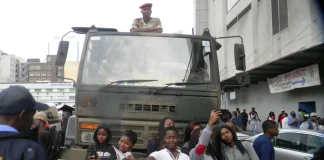 Mnangagwa reproducing the very conditions that facilitated Mugabe’s downfall Harare,Zimbabwe,18 November 2017. Flag waving anti-Mugabe protesters taking selfies in front of an army truck during anti -Mugabe demostrations in solidarity with the miullitary intervention. — Photo by Maboss283 via DepositPhotos.com