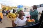 Impressive IMF economic growth rates are meaningless to Zimbabweans drowning in a sea of grinding poverty Woman selling fruits on a parking lot in Zimbabwe, 2016— Photo by YuryBirukov via DepositPhotos.com